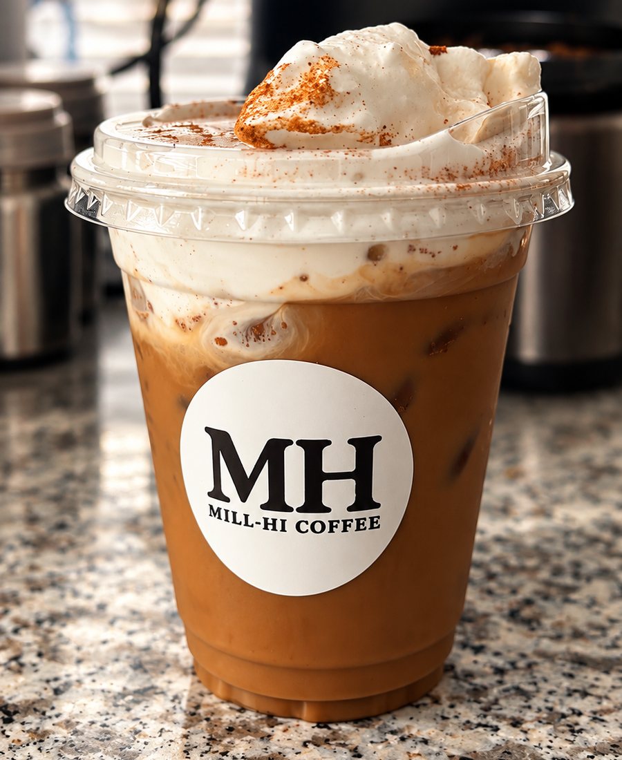Mill-Hi Coffee iced latte with cream and a branded cup sticker